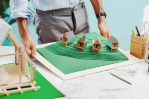 An architect shows the model of his project. Concept of New Ideas and Solutions for Sustainable Architecture.